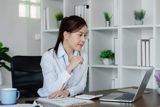 business woman entrepreneur in office using laptop at work, smiling professional female company executive wearing suit working on computer at workplace.