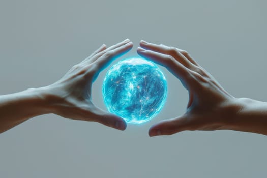 A blue energy ball in the hands of a man on a gray background