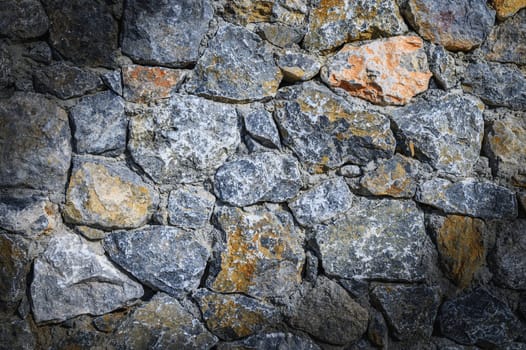 Stone wall texture background - grey stone siding with different sized stones 1