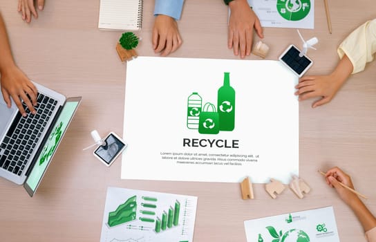 Recycle packaging placed on a meeting table during a green business meeting discussion. ESG environment social governance and Eco conservative concept. Top view. Delineation.