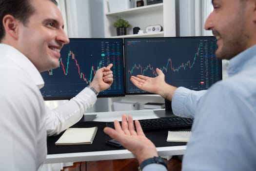 Successful stock exchange traders focusing on high profit chart investment on dynamic database, analyzing on monitor. Concept of discussing financial technology growth at workplace. Sellable.