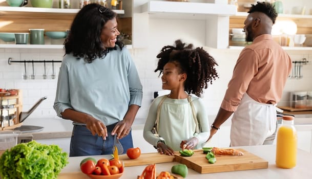 Happy family with father, mother and daughter in the kitchen, happy mom, dad and child with attachment and relationship, lifestyle and nutrition concept. High quality image