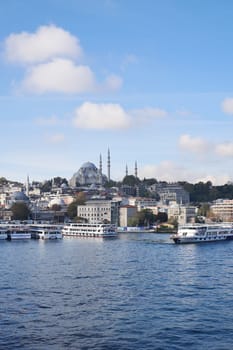 Turkey istanbul 19 june 2023. ferryboats parked in the waters of the Bosphorus river nearby the Eminonu Mosque,
