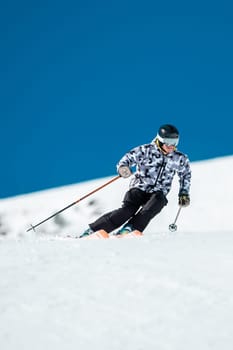 Expert skier on the slopes of Grandvalira in Andorra in Winter 2024.