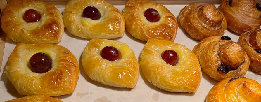 freshly baked danish pastry with apricot jam fruity jelly super delicious warm fresh buttery baked pastries with apricot and peach in bakery kitchen