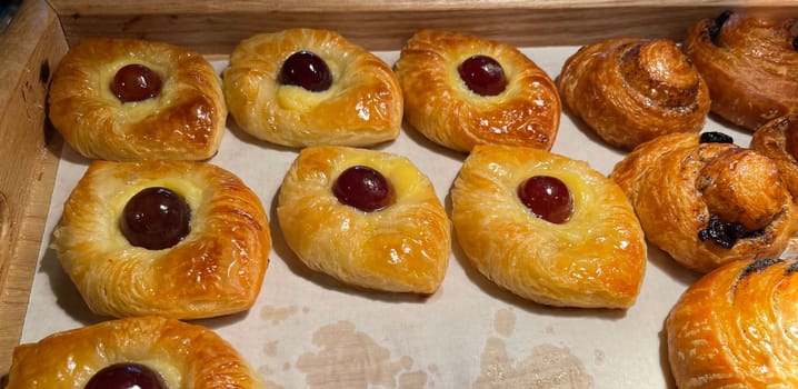 freshly baked danish pastry with apricot jam fruity jelly super delicious warm fresh buttery baked pastries with apricot and peach in bakery kitchen