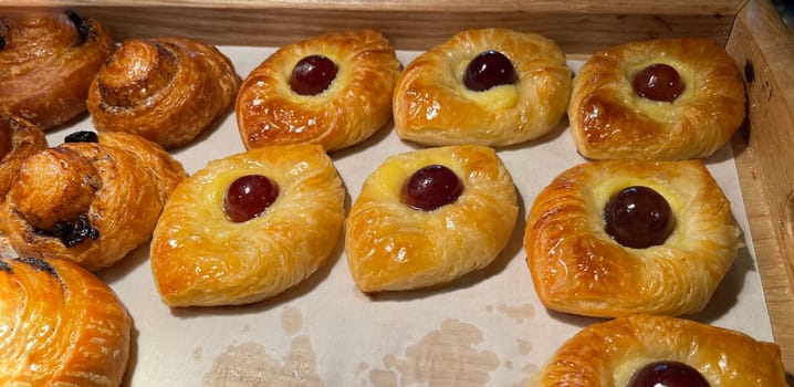 freshly baked danish pastry with apricot jam fruity jelly super delicious warm fresh buttery baked pastries with apricot and peach in bakery kitchen