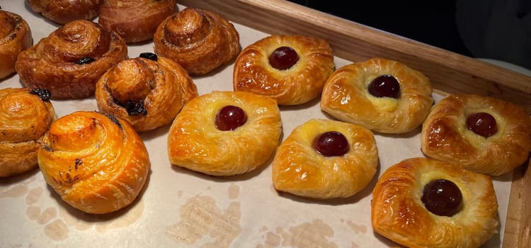 freshly baked danish pastry with apricot jam fruity jelly super delicious warm fresh buttery baked pastries with apricot and peach from baker's kitchen