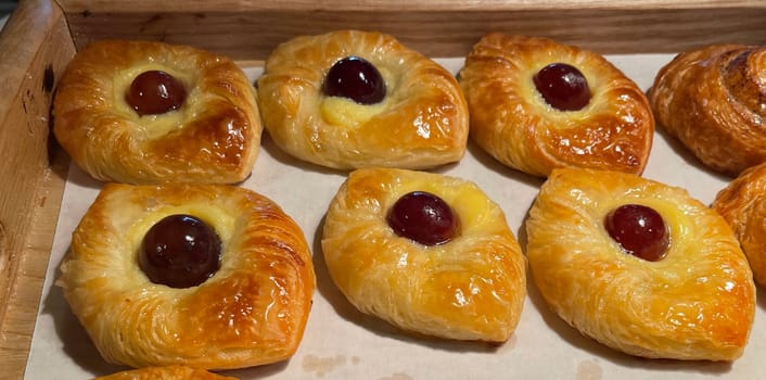 freshly baked danish pastry with apricot jam fruity jelly super delicious warm fresh buttery baked pastries with apricot and peach in bakery kitchen