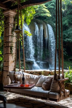 Stylish interior with swings on the background of a lake with a waterfall.