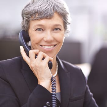 Senior woman, portrait and telemarketing phone call with communication and smile from work. Crm, telephone and support with conversation and professional female employee with talking in office.