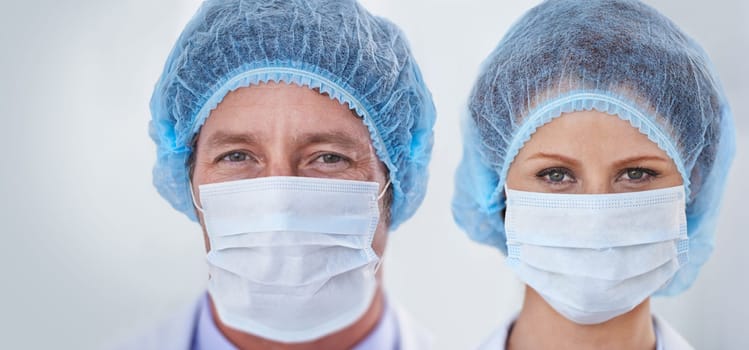 Face mask, doctors and portrait with surgery and safety gear for healthcare and wellness job. Hospital, ppe and people in clinic with working and health protocol in facility with care and staff.