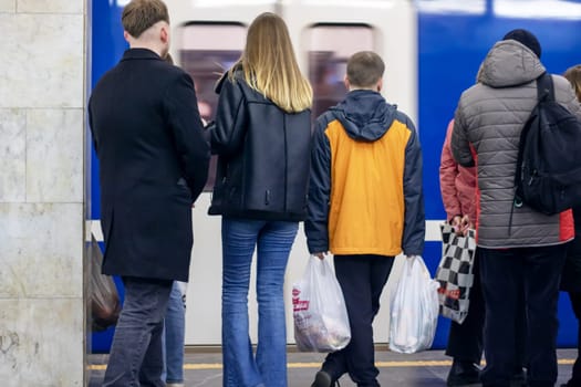 Belarus, Minsk - 07 february, 2024: People at the train in the subway