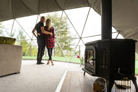 a couple dancing in geo dome tents