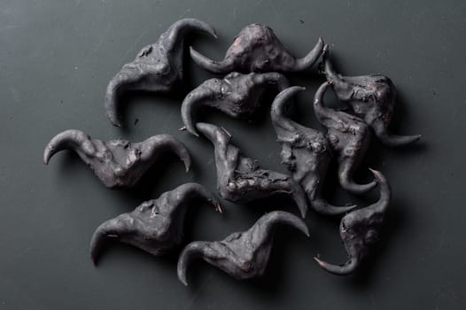 Water caltrop on a black background, Water Chestnut, Trapa natans