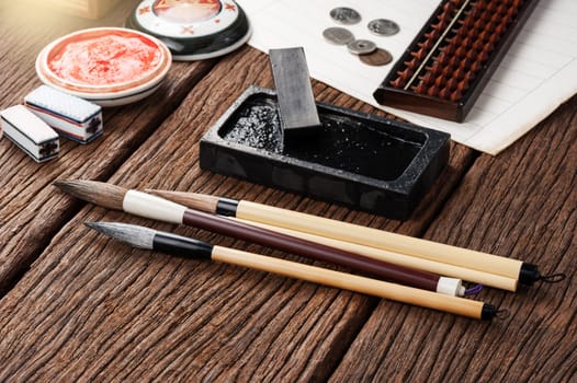 closeup traditional writing brush and inkstone on the desktop, Japanese writing brush, Chinese writing brush