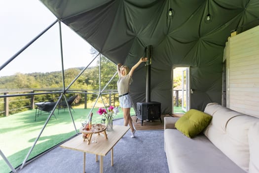 female tourist in transparent hotel dome.