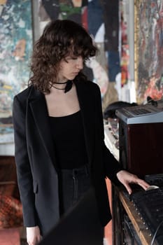 portrait of a young beautiful woman with curly hair in the studio