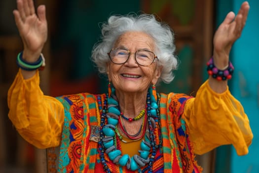 Happy and playful elderly woman in colored clothes indoors.