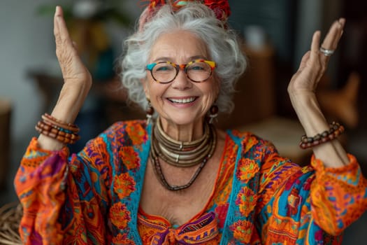 Happy and playful elderly woman in colored clothes indoors.