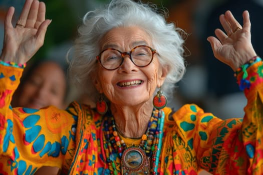 Happy and playful elderly woman in colored clothes indoors.