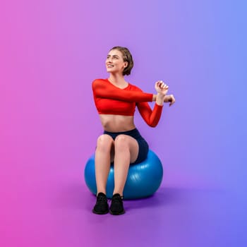 Full body length gaiety shot athletic and sporty young woman with fitness exercising ball in standing posture on isolated background. Healthy active and body care lifestyle.