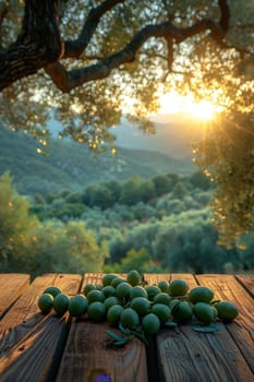 still life with green olives on a table in an olive grove.