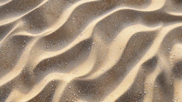 A close up of a sandy beach with some waves in the background