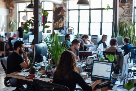 The dynamic atmosphere of a startup office is evident with teams working collaboratively amidst computers and casual decor. The focus and teamwork embody the innovative spirit