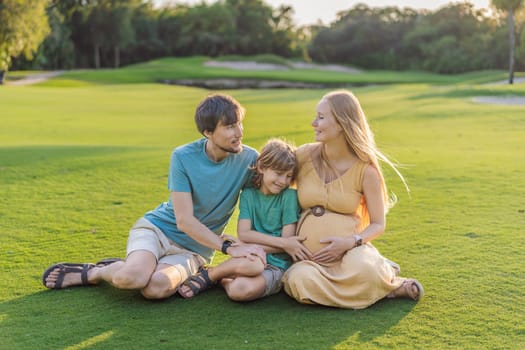 Joyful family time as a pregnant woman, her husband, and son share quality moments outdoors, embracing the beauty of nature and creating cherished memories together.