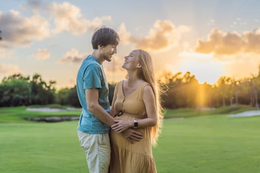 A blissful moment as a pregnant woman and her husband spend quality time together outdoors, savoring each other's company and enjoying the serenity of nature.