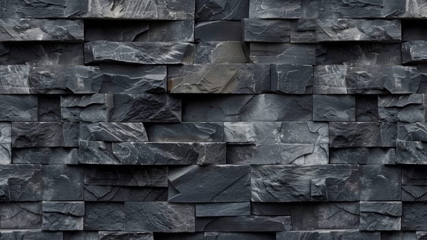 A close up of a black and grey stone wall