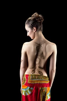 Mehendi. Image of woman's back painted with henna