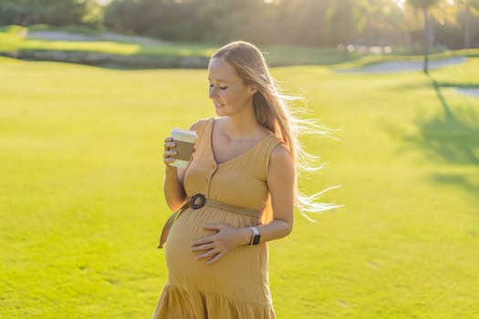 pregnant woman enjoys a cup of coffee outdoors, blending the simple pleasures of nature with the comforting warmth of a beverage during her pregnancy.