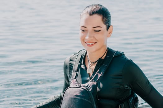 Happy smiling woman in kayak on ocean, paddling with wooden oar. Calm sea water and horizon in background