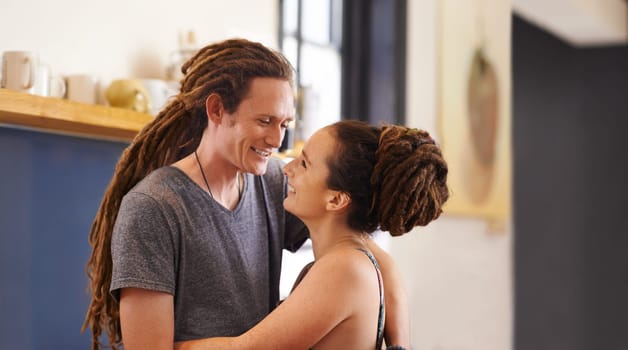 Hug, rasta and home with couple, love and bonding together with happiness and relaxing. Marriage, apartment and embrace with romance and dreadlocks with relationship and cheerful with man and woman.