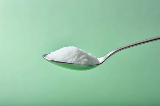 Sugar in a spoon on background, close-up. isolated. Food concept.