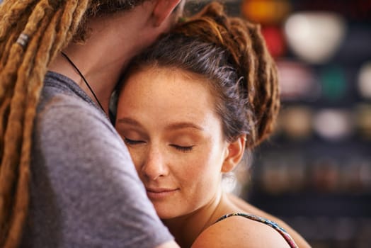 Hug, rasta and home with couple, marriage and bonding together with happiness and relaxing. Peaceful, apartment and embrace with romance and dreadlocks with relationship and love with man and woman.