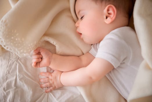 Baby, sleeping and tired at home with relax, nap and nursery with peace in a bed with blanket. Morning, youth and kid with dream of an infant with child development from rest in bedroom with newborn.