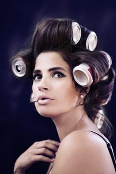 Studio, rollers and haircare for woman with glamour, creative and curling with cans for soda on head. Adult, girl and female person with confidence of style, texture and model with aesthetic.