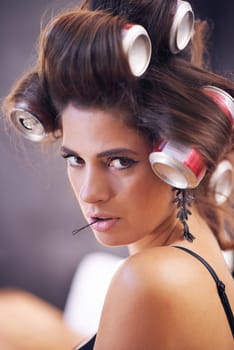 Glamour, curlers and woman with hair, portrait and creative for curling with cans for soda on head. Adult, girl and female person with confidence of style, texture and aesthetic for grooming tools.