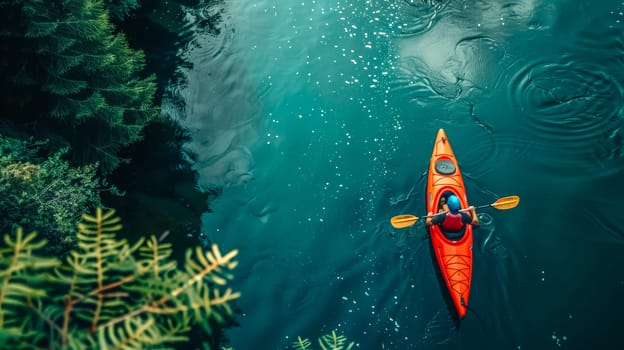 Overhead shot of an individual paddling in a red kayak, surrounded by calm waters and greenery