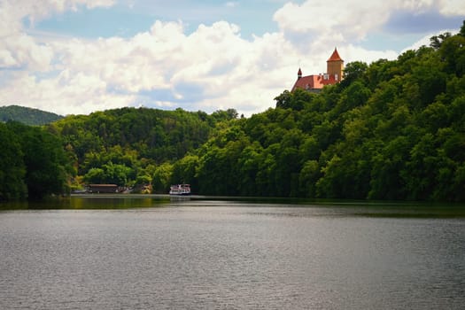 Beautiful Gothic castle Veveri. The city of Brno at the Brno dam. South Moravia - Czech Republic - Central Europe. Spring landscape.