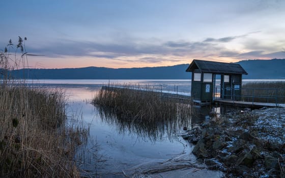 Panoramic image of Laacher lake during morning hours, Eifel, Rhineland-Palatinate, Germany