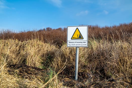 NARIN, PORTNOO / IRELAND - JANUARY 15 2020 : Sign warning of tide.