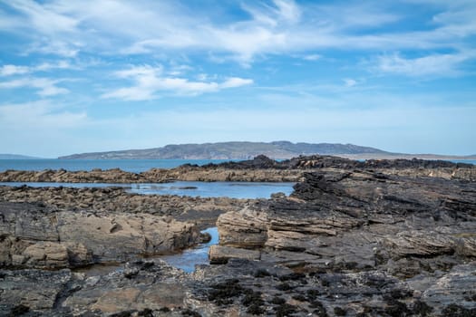 The rocks of Carrickfad by Portnoo at Narin Strand in County Donegal Ireland.