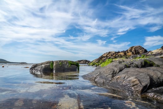 The rocks of Carrickfad by Portnoo at Narin Strand in County Donegal Ireland.