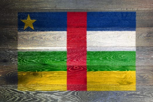 A Central African Republic flag on rustic old wood surface background