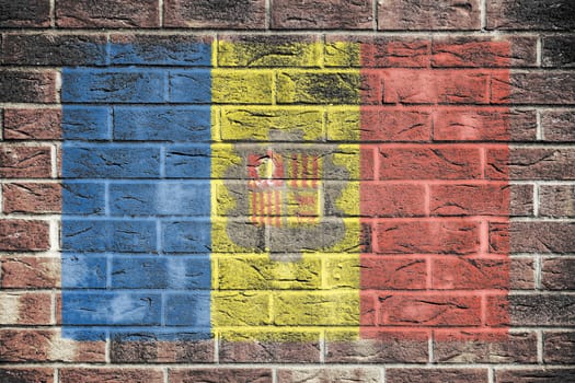 An Andorra flag on a brick wall background
