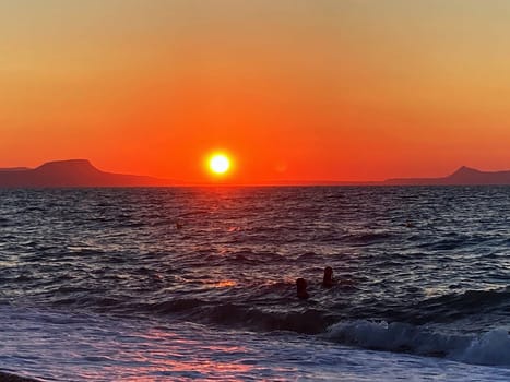 summer sunset on the sea coast in Creta, Greece, at 02 August 2023. Beautiful sunset by the sea in a beach on Kreta. Fantastic sunset on the Mediterranean Crete. High quality photo